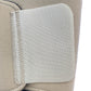 The Bio Magnetic Knee Support in beige up close showing the back of the upper adhesive tab that holds the support in place. 