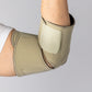 Bio Magnetic Elbow Support in Beige from the front inside view on an elderly woman.
