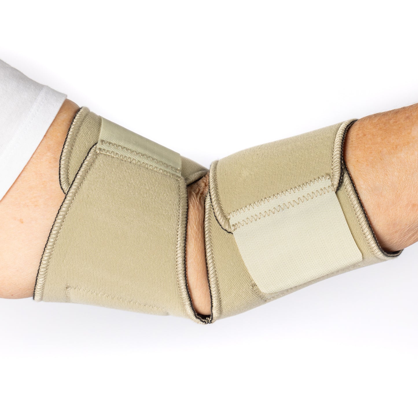 Inside view of the Bio Magnetic Beige Elbow Support Wrap on an elderly woman.