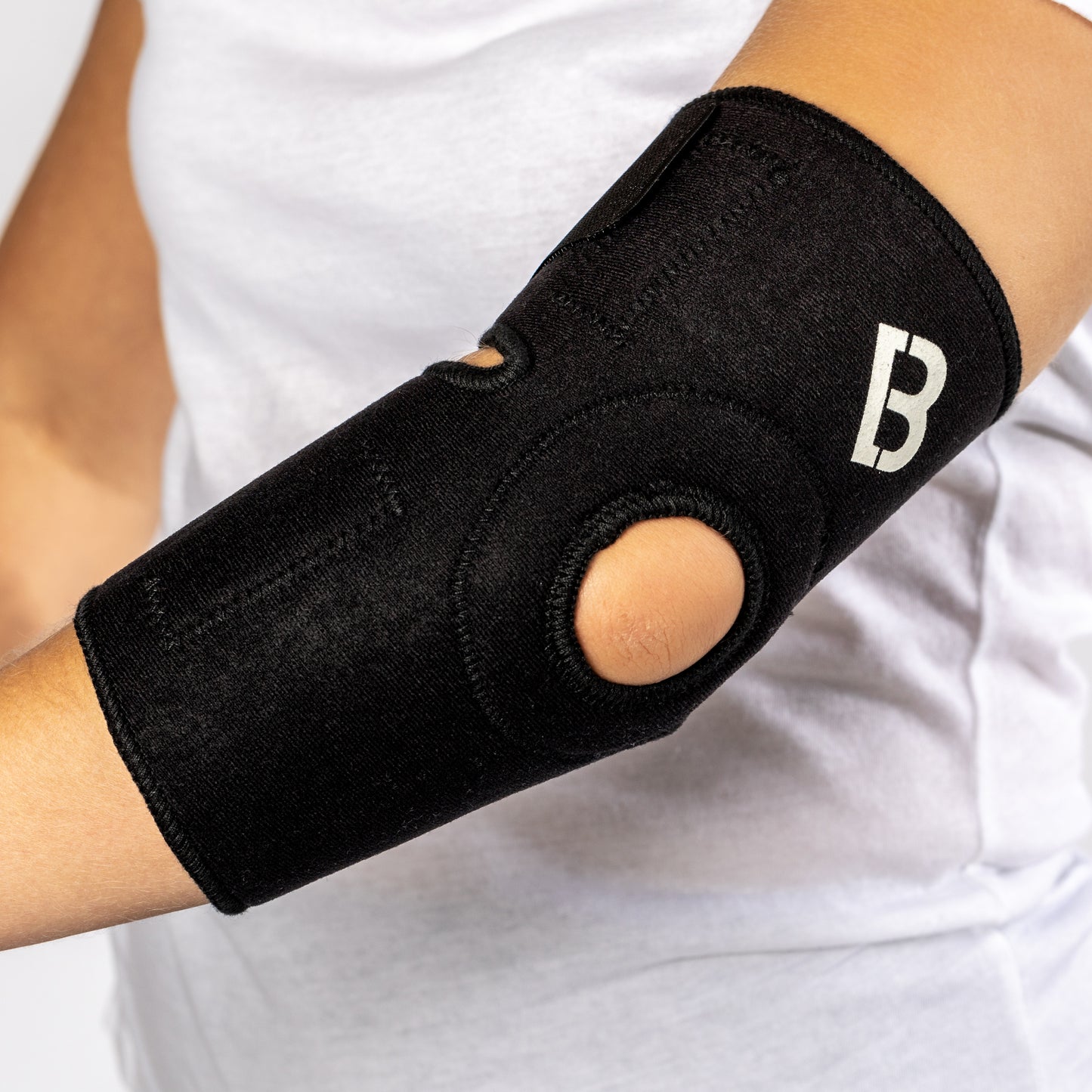 Black Bio Magnetic Elbow Support side view of the flexibility hole.