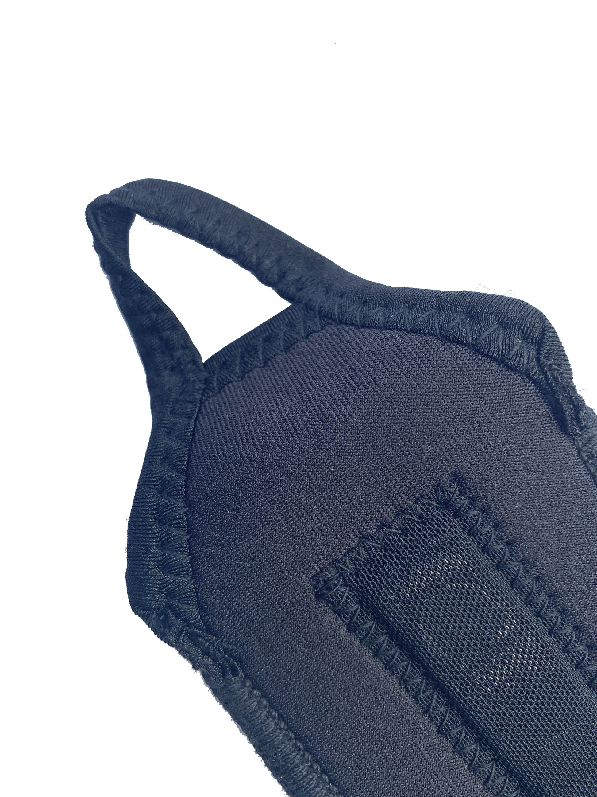 An up close shot of the thumb loop on the bio magnetic wrist support in black.