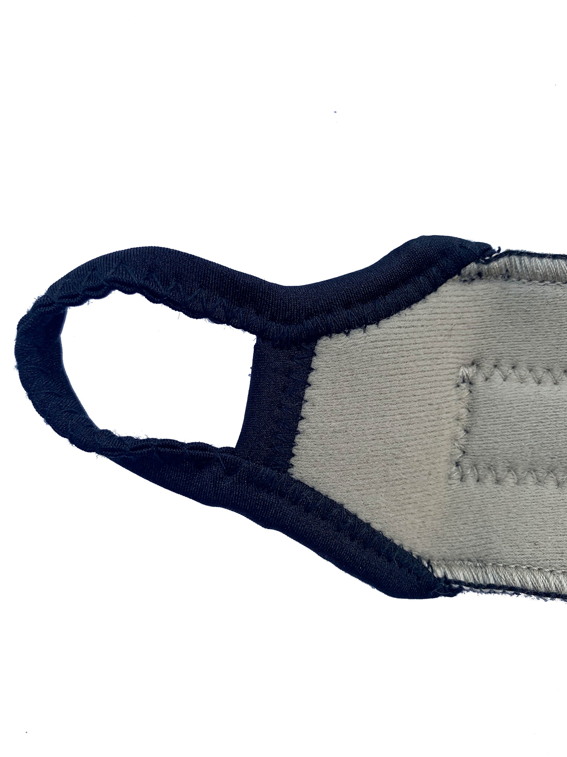 An up close shot of the beige Bio Magnetic Wrist Support thumb loop.