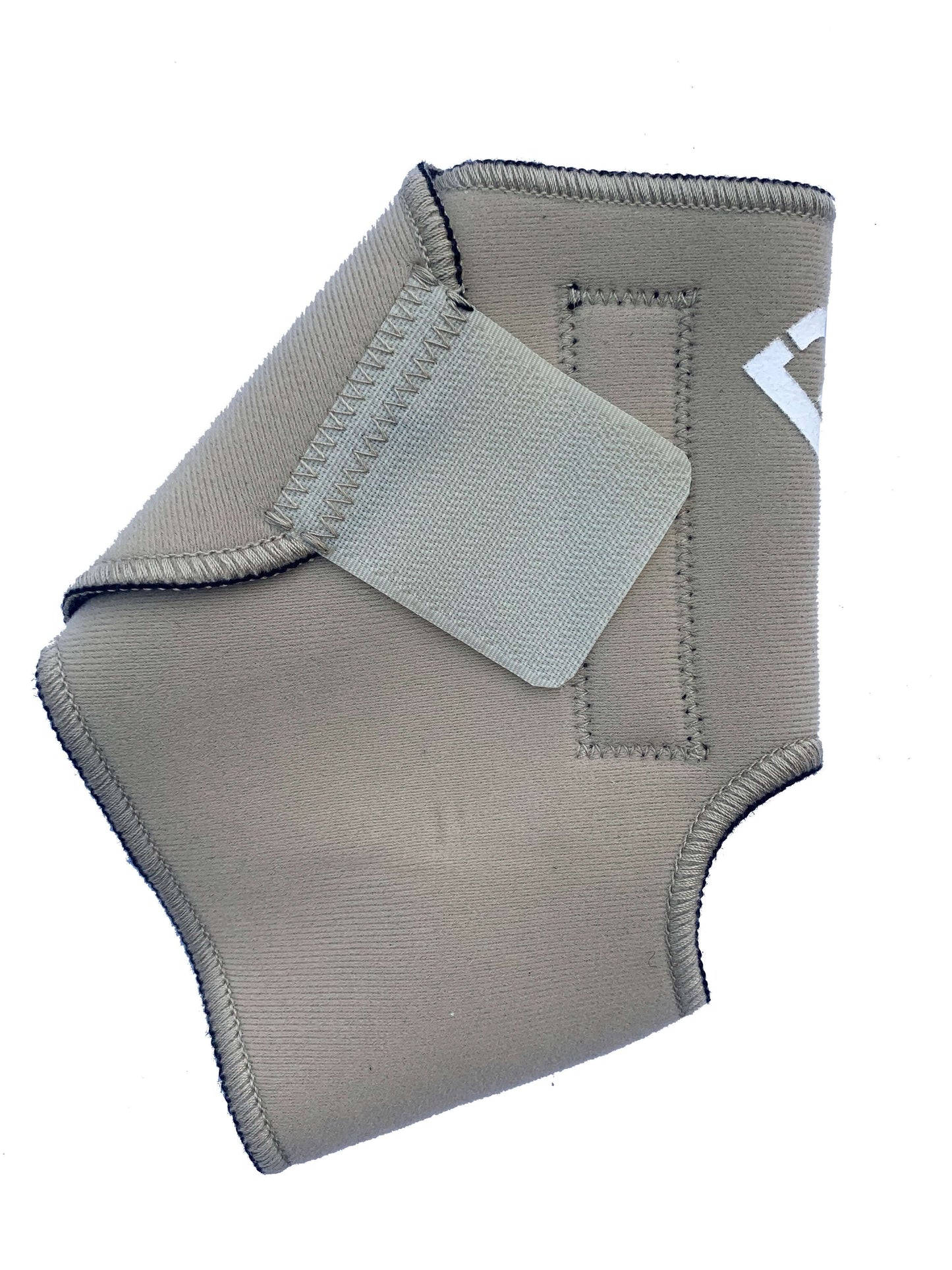 The Bio Magnetic Ankle Support in beige laying flat with the adhesive closure closed, a strip of 4 of the 8 therapeutic grade magnets can be seen running down the length of the support. The adhesive closure is a slightly lighter colour beige than the neoprene that is used on the support.