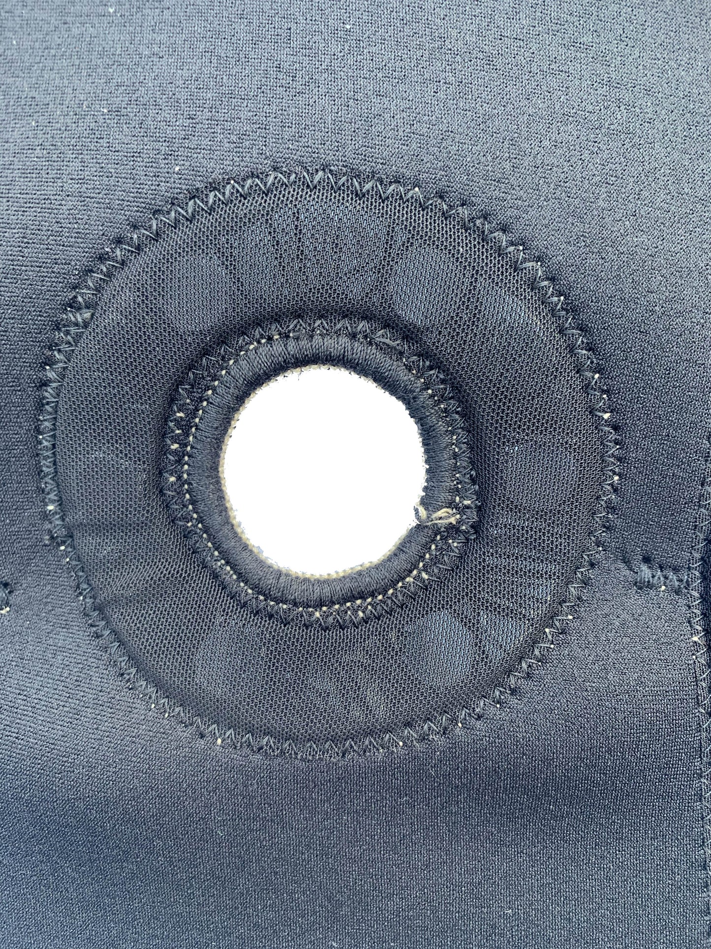 An up close shot of the bio Magnetic knee support knee cap hole which allows for greater support of the knee cap and patella. 
