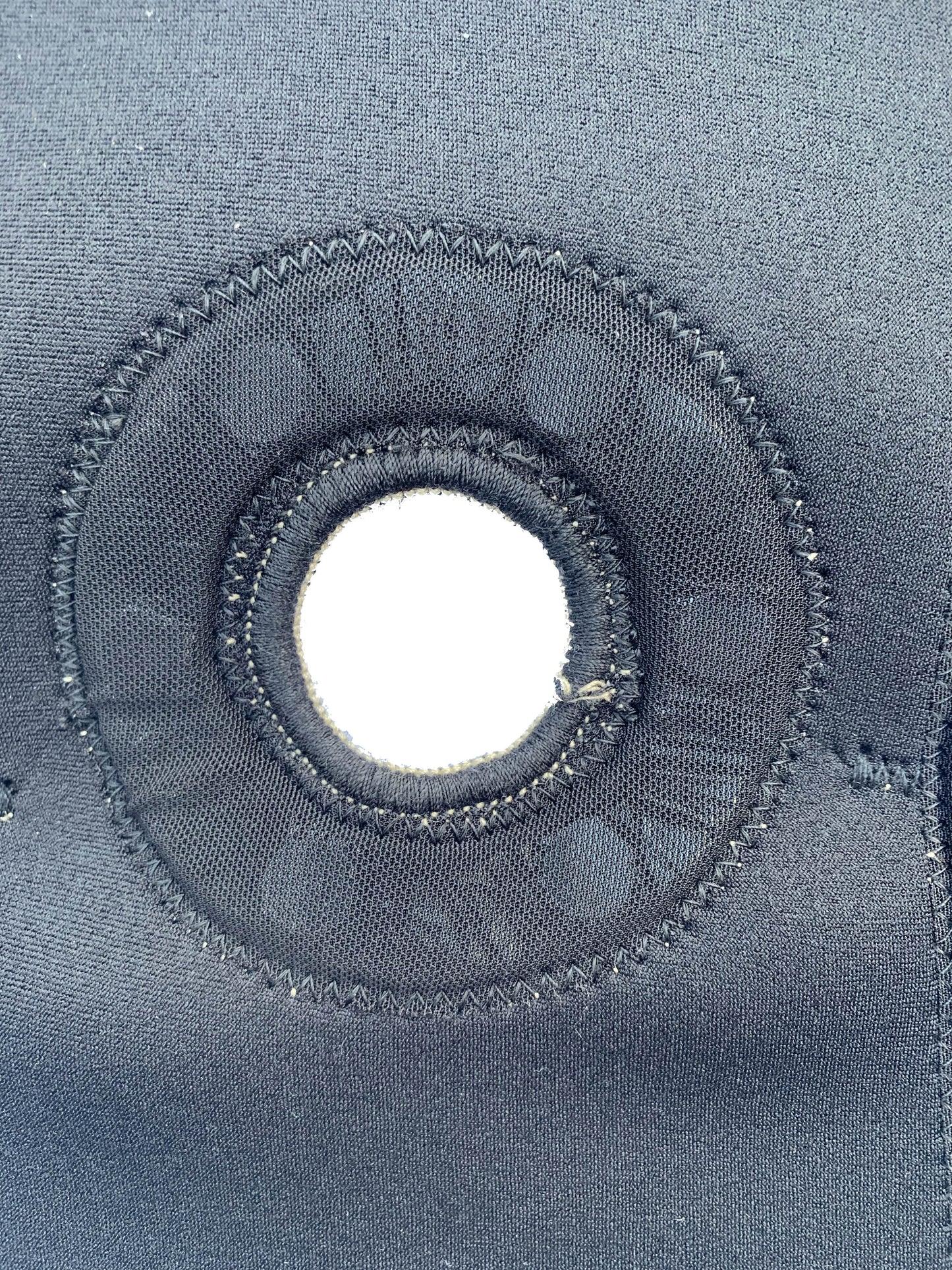 An up close shot of the bio Magnetic knee support knee cap hole which allows for greater support of the knee cap and patella.