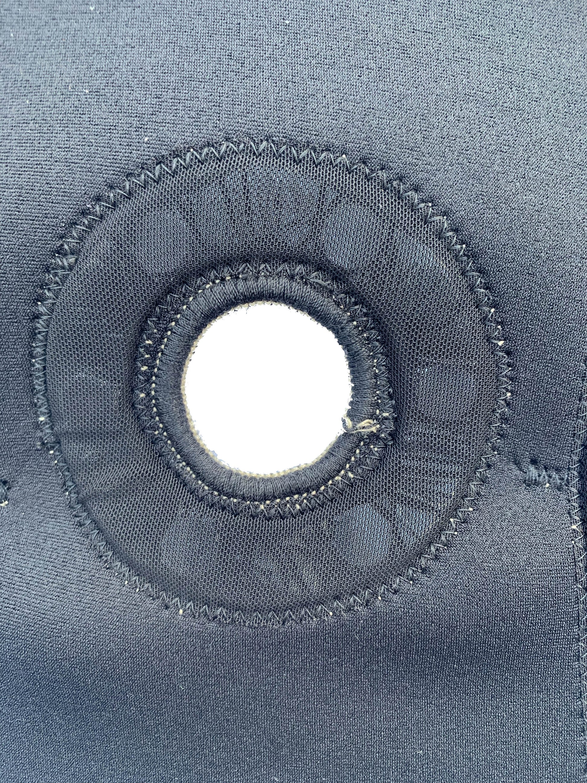 An up close shot of the bio Magnetic knee support knee cap hole which allows for greater support of the knee cap and patella.