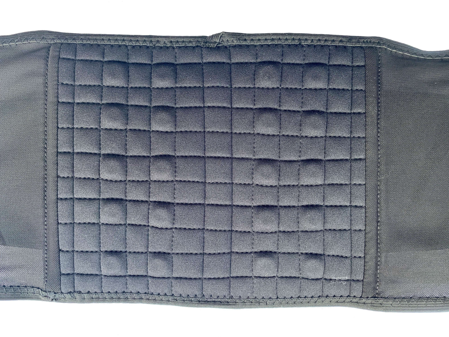 A close up view of The Bio Magnetic Back Support twenty embedded therapeutic magnets. Pictured here you can see each therapeutic magnet as a bump underneath the soft neoprene fabric. Each magnets is sewn securely into place within the fabric.