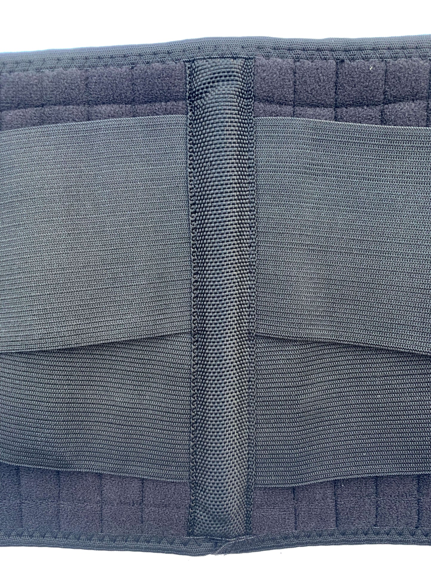 The middle of the back of the Bio Magnetic Back Support showing an up close shot of the largest stay that is included in the Bio Magnetic Back Support.