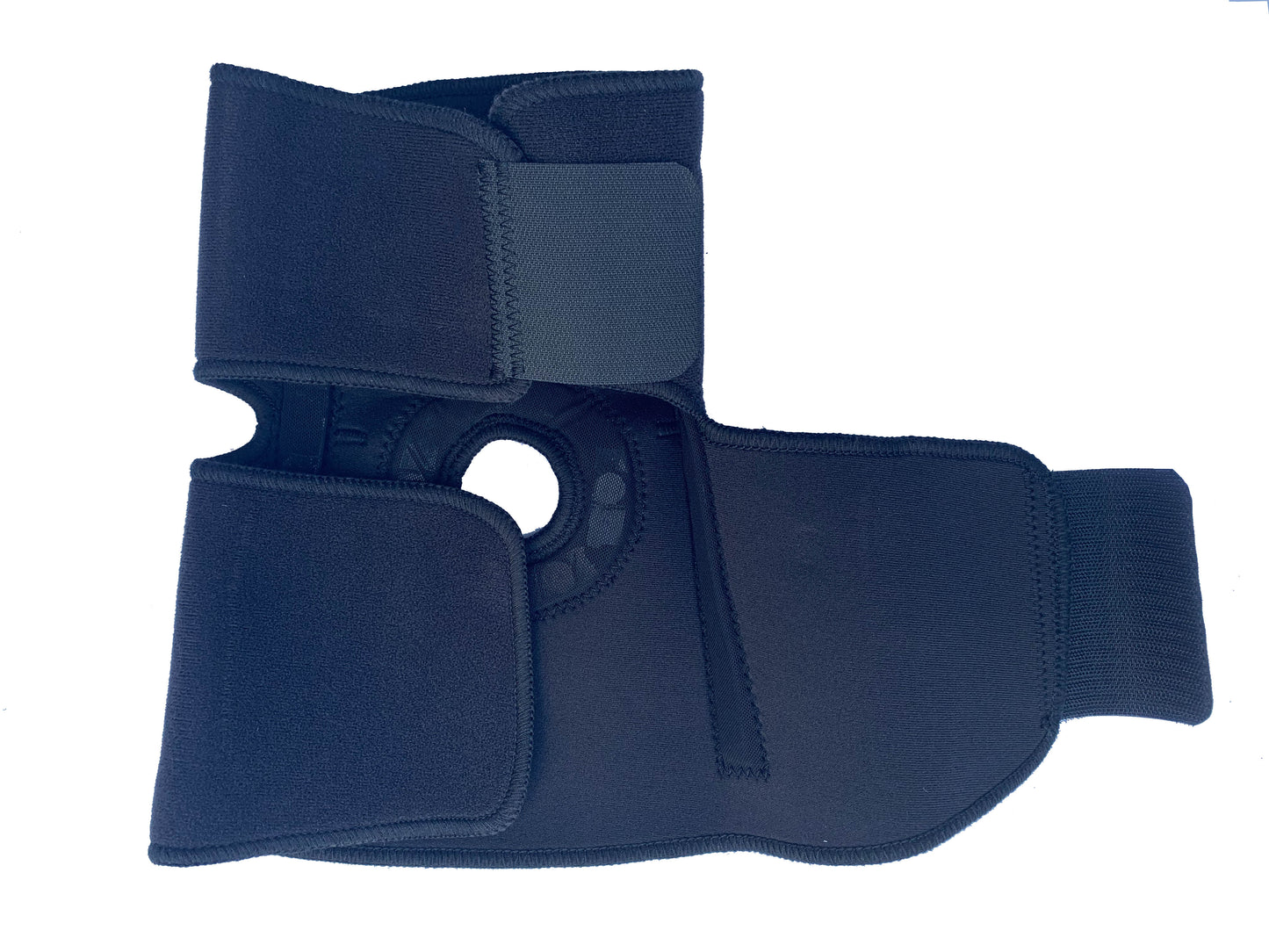 The inside of the Bio Magnetic Elbow Support showing the top half closed securely and the bottom half open showing some of the embedded magnets within the support. 