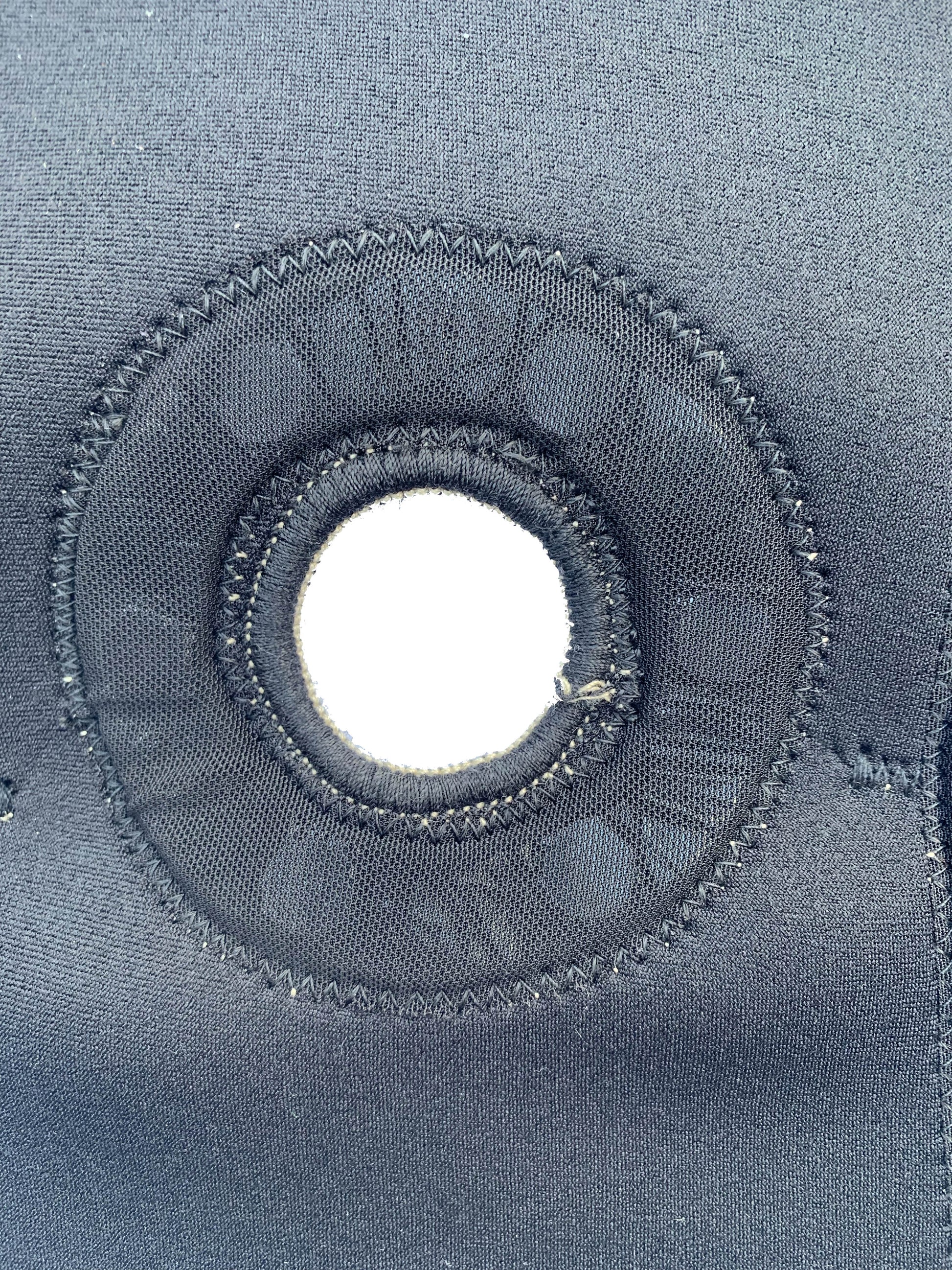 An up close shot of the bio Magnetic knee support knee cap hole which allows for greater support of the knee cap and patella. 