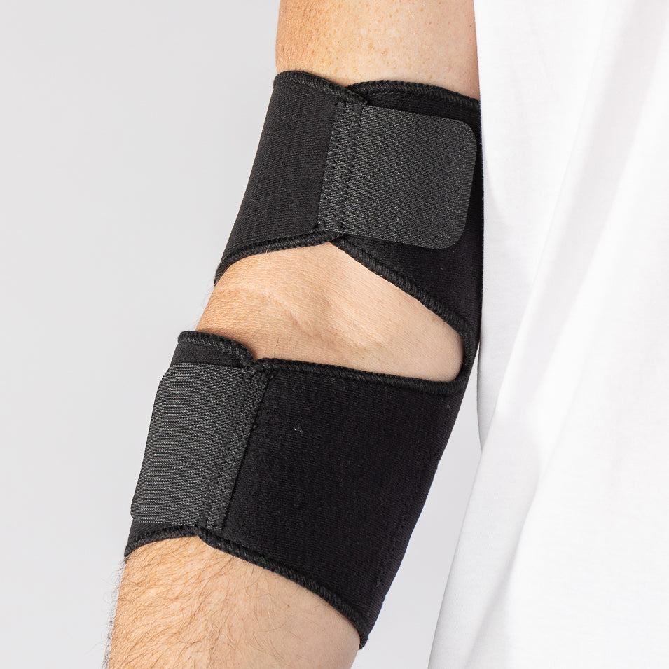 Bio Magnetic Elbow Support in Black from the inside view of the support on a man's elbow. 