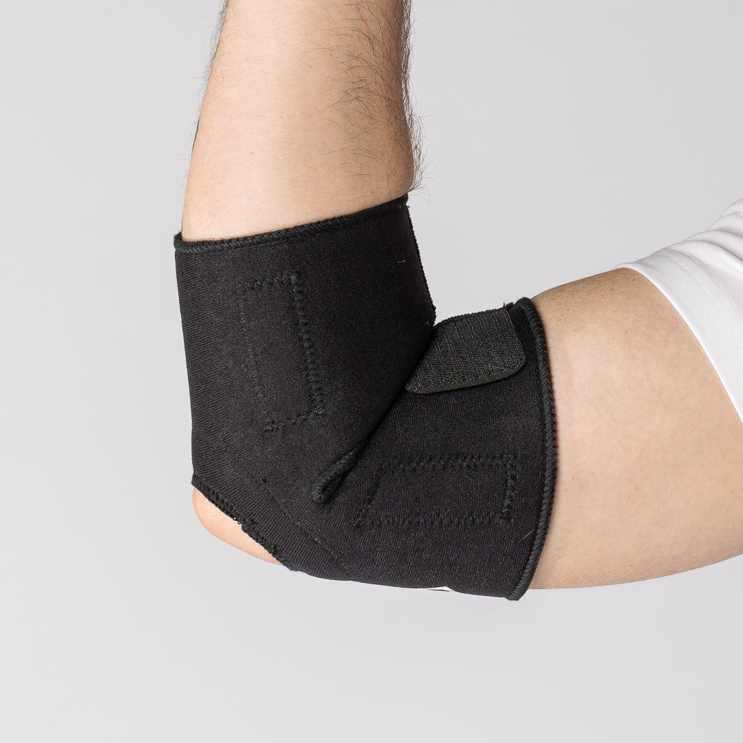 Bio Magnetic Elbow Support Wrap in black on a man bending his arm up and viewing it from the inside. 