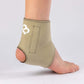 Beige Magnetic Ankle Support with 8 therapeutic grade magnets being worn on the foot of a person who is standing. It is offering them increased support in the ankle.